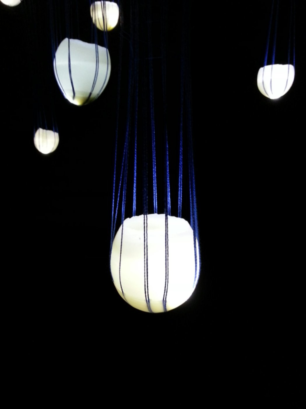 abbie r powers installation art made of silk and string, wax, light